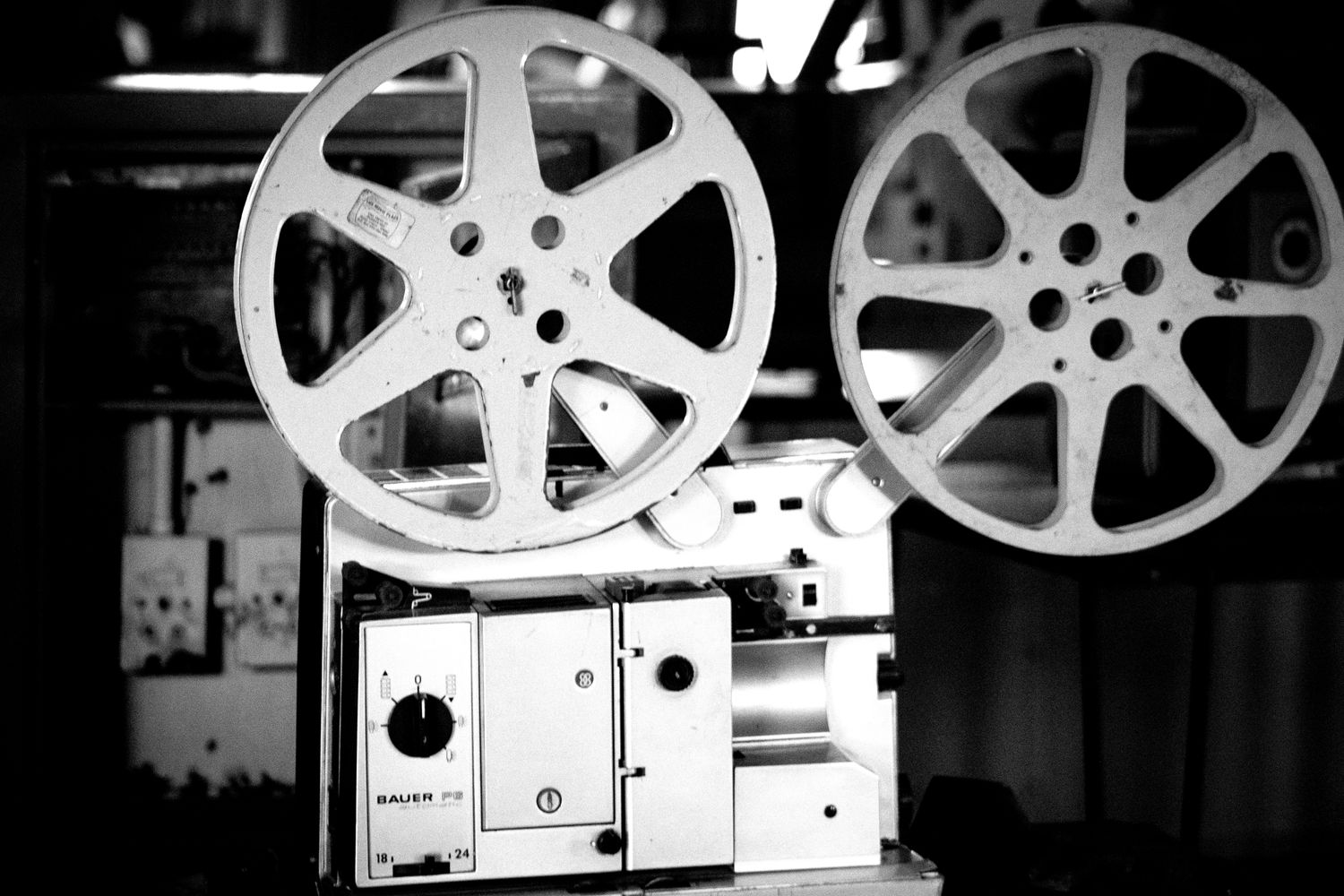 Vintage film reels and projection equipment