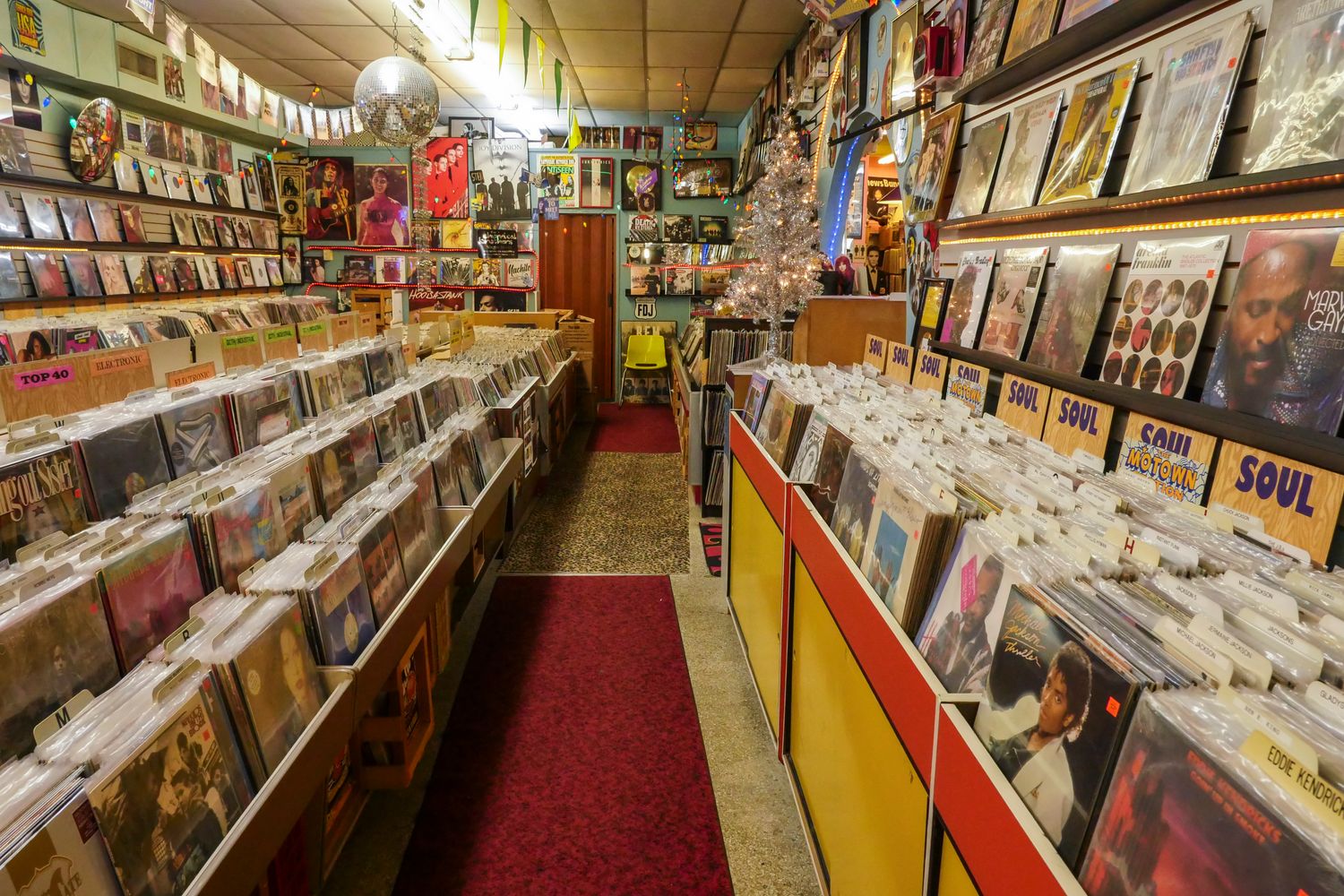 Vinyl record sleeves arranged in a music shop